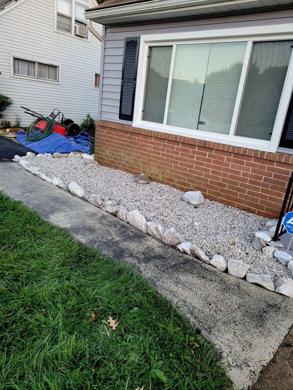 Residential exterior with a gravel landscape border